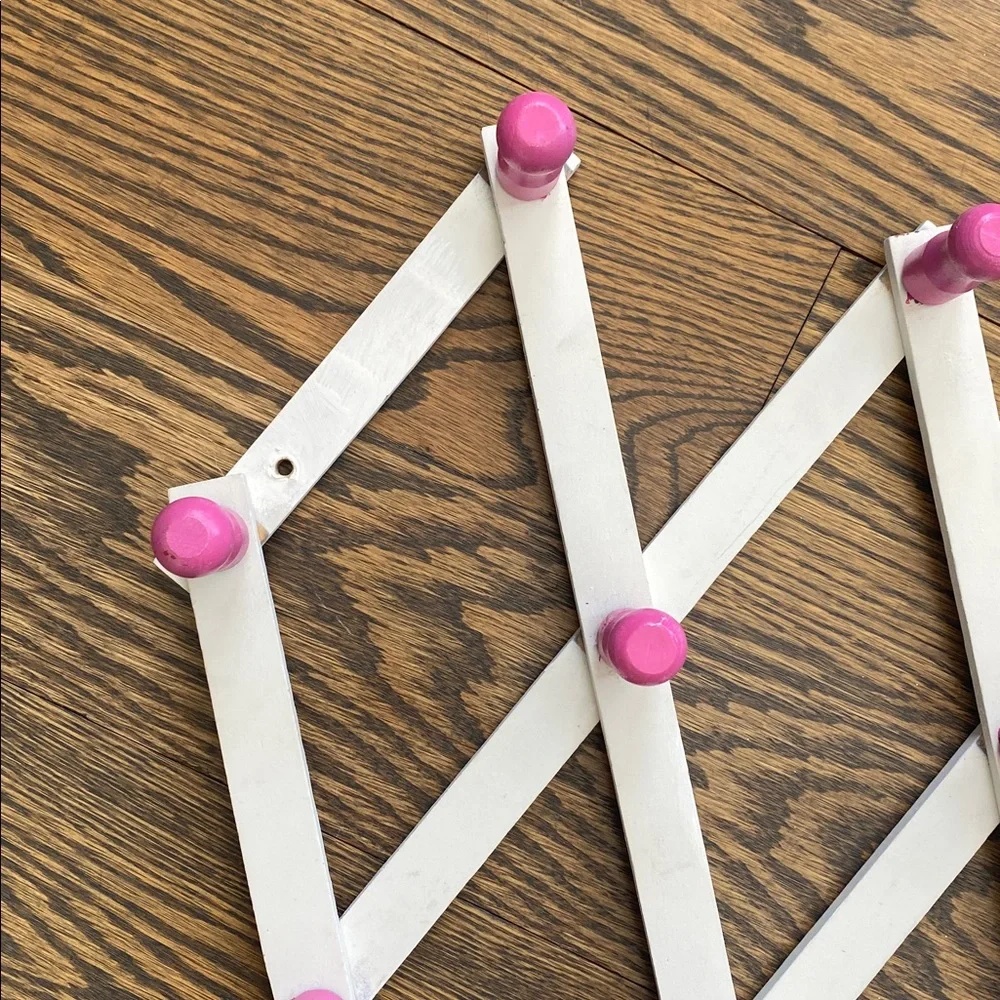 White and Pink Expandable Wall Rack